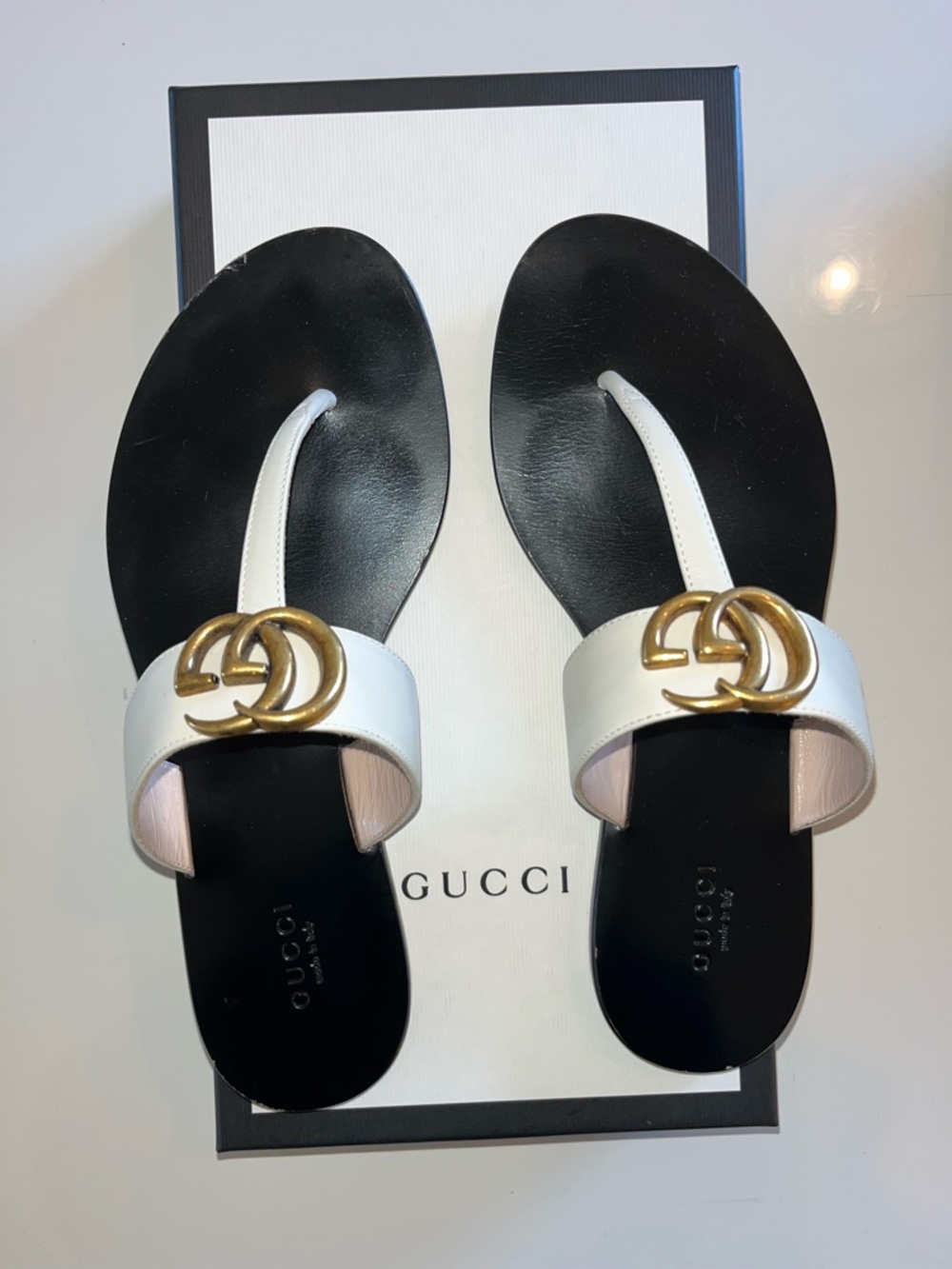 Gucci White Leather Thong Sandals with Gold Accent
